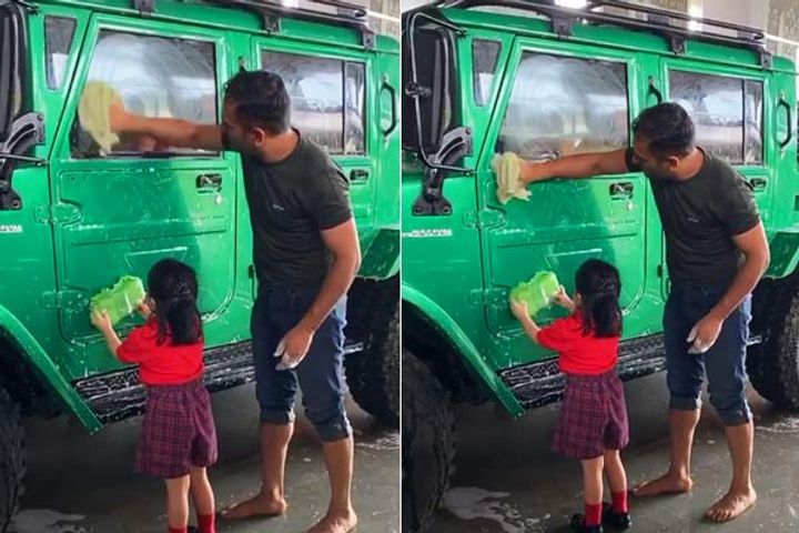 Jeeva Dhoni was seen helping father