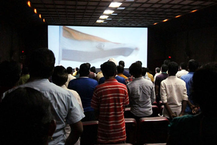 A family was ridiculed for purportedly not standing up in cinema during National Anthem