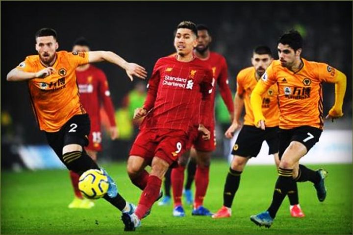 Liverpool unbeaten record comes under threat but Wolves toppled by Roberto Firmino late strike