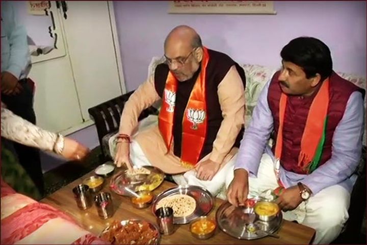 Shah has meal at Delhi BJP worker house after campaigning