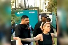 Watching Dhoni surrounded by fans  celebrity hair stylist becomes his bodyguard  video viral