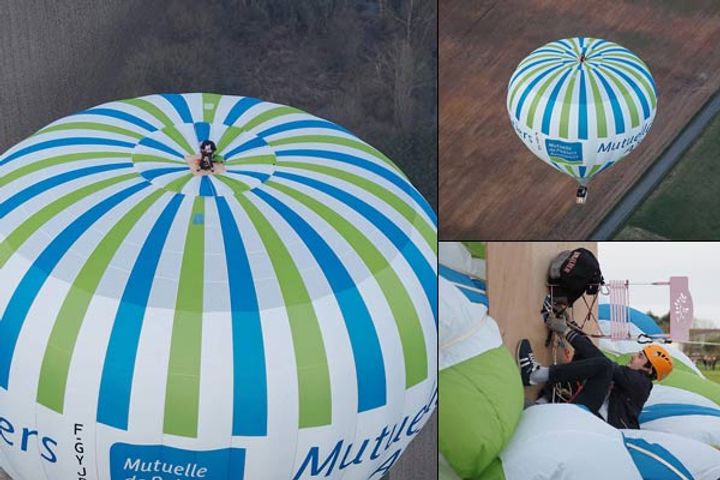 Man dances on hot air balloon flying at a height of 3280 feet