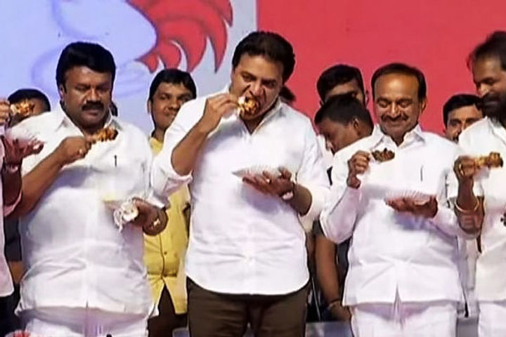 Dismissing the coronavirus rumours Telangana Ministers eat chicken in public