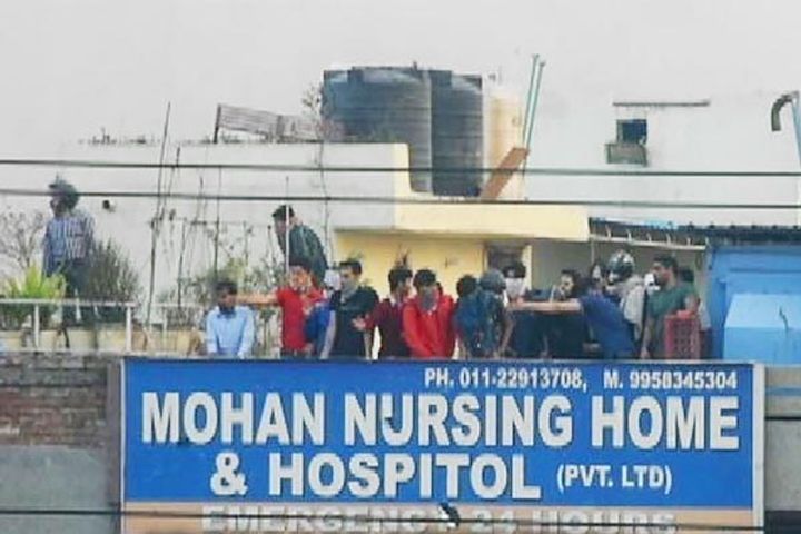 New video shows men firing on crowd from hospital roof during Delhi riots New video shows men firing on crowd from hospital roof during Delhi riots