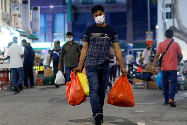 Singapore quarantines 20,000 migrant workers after COVID-19 cases rise