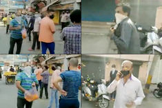 Delhi man showers flower petals on people standing in queue outside liquor shops