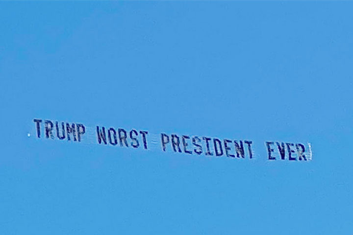 The banner waved in the sky in Florida wrote The worst presidential trump ever