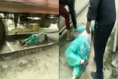 Woman saved her life by lying down on a railway track in Haryana's Rohtak after she got trapped 