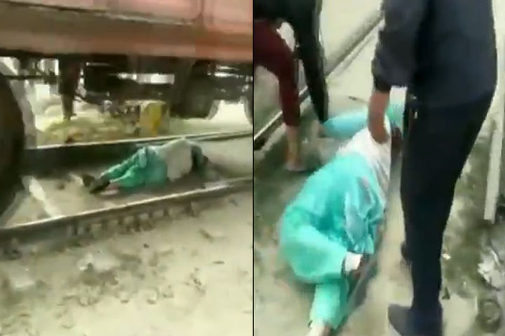 Woman saved her life by lying down on a railway track in Haryana's Rohtak after she got trapped 