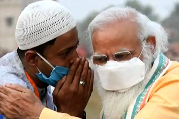 Muslim man whispering in PM's ears