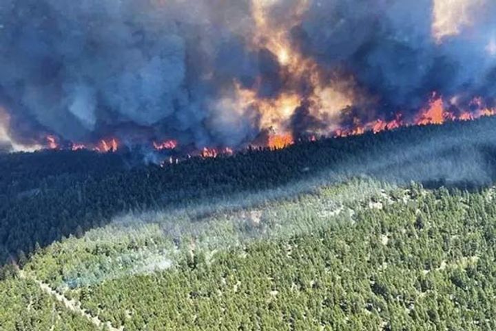 people evacuated in and around western Canadian village as wildfire rages amid heatwave