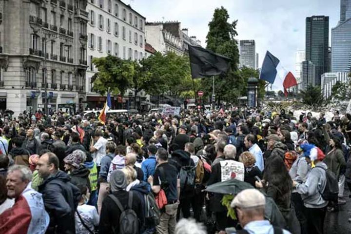 despite protests france will implement macrons covid19 pass from today despite protests france will implement macrons covid19 pass from today