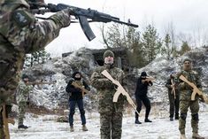 common people in ukraine are practicing fighting with fake guns