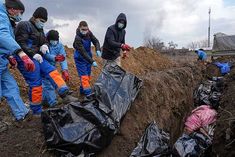 dead bodies buried in mass graves in mariupol air strikes on maternity hospital