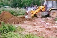 Bulldozers run on illegal construction