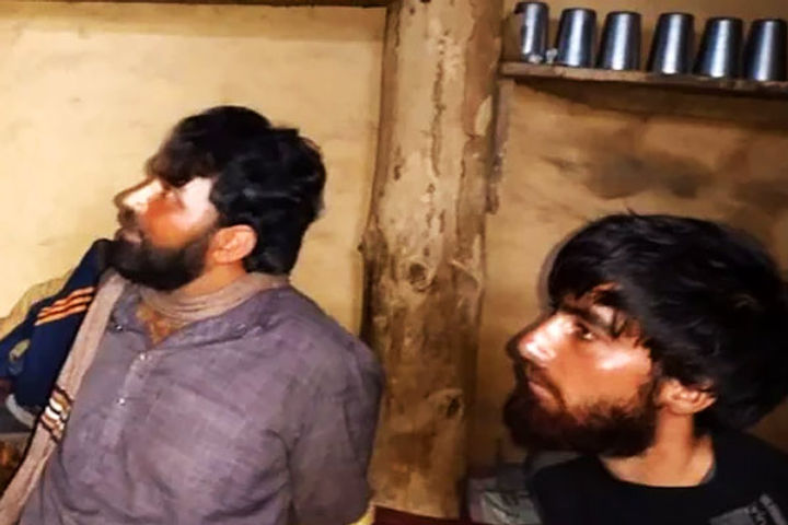 armed lashkar terrorists tied with rope by villagers