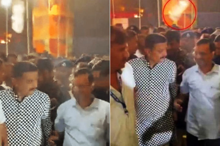 bottle thrown at arvind kejriwal who went to watch garba in rajkot bottle thrown at arvind kejriwal who went to watch garba in rajkot