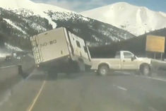 car towing truck overturned couple narrowly escaped video surfaced from america