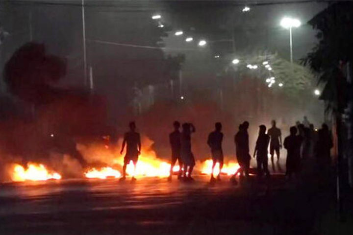 mob sets fire to two buses used by security forces